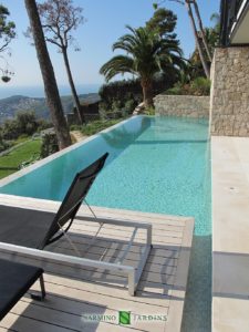 A splendid view of Cap Ferrat next to a swimming pool in a villa