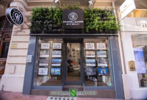 Green plant sign at the real estate agency Coldwell Banker Etic Realty in Monaco