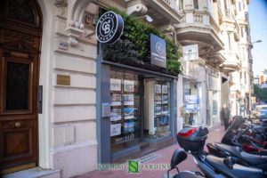 Green plant sign at the real estate agency Coldwell Banker Etic Realty in Monaco